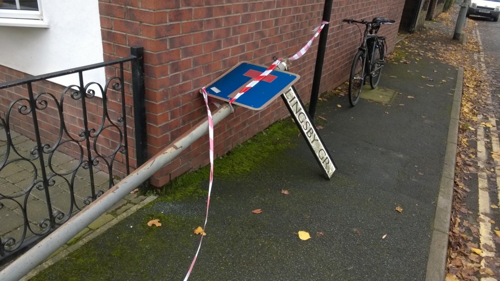 The street sign at the top of Slingsby Grove has fallen over - corrosion may have been the cause